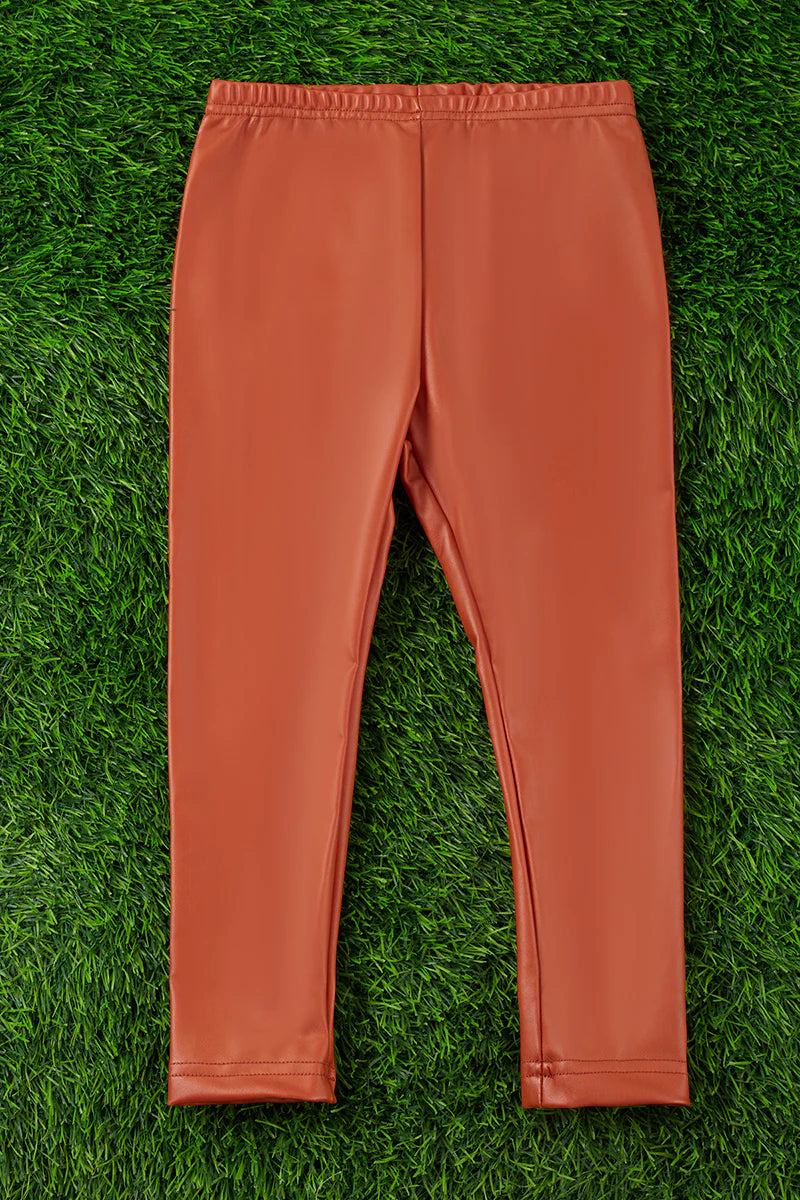 Rust faux leather leggings